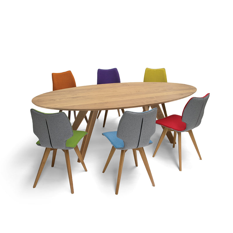 c1 chairs around a dinihg table- grey backs and multi coloured chair fronts; purple orange, green, yellow, blue, red