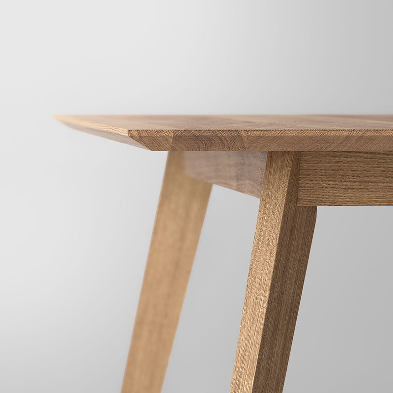 Close up of angled edge and leg detail of the oak citie dining table