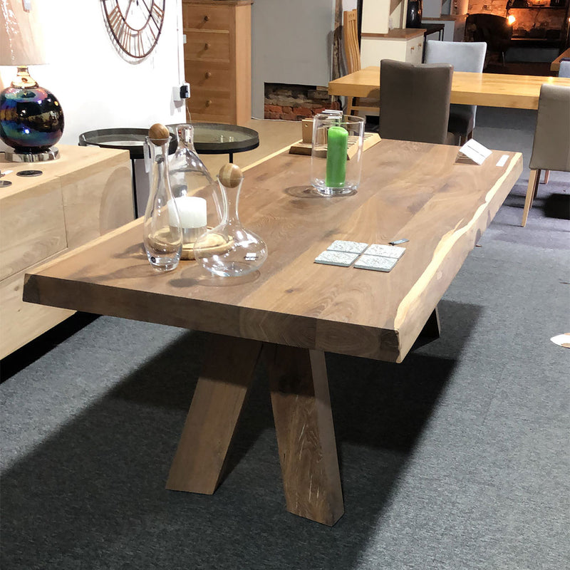 river oak dining table with solid oak legs and raw natural table edge