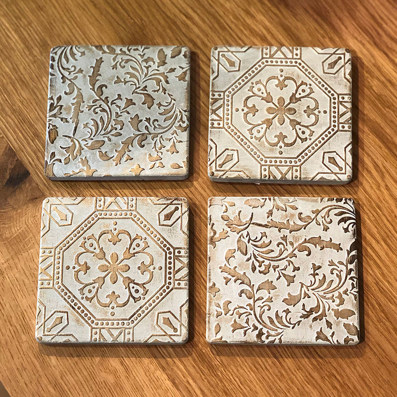Tile coasters on wooden table top.
