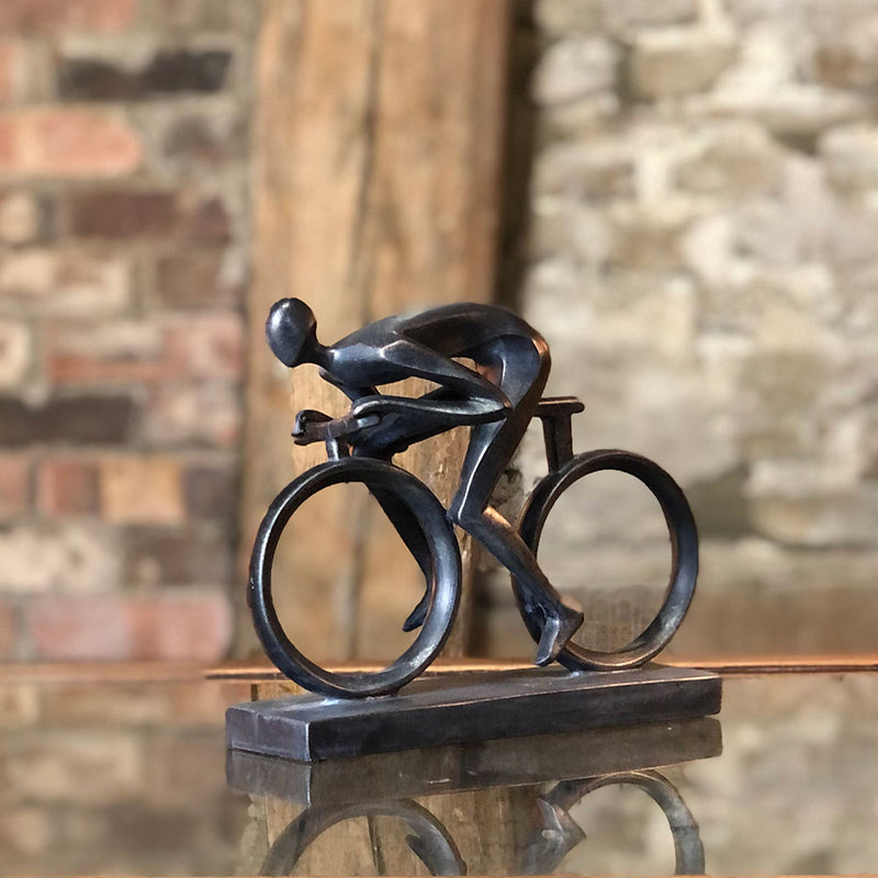 contemporary smooth resin cyclist on bicycle.