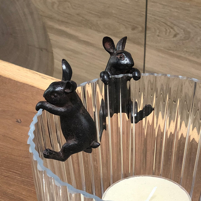 decorative dark finish hanging hare, holds onto a pot or hurricane.