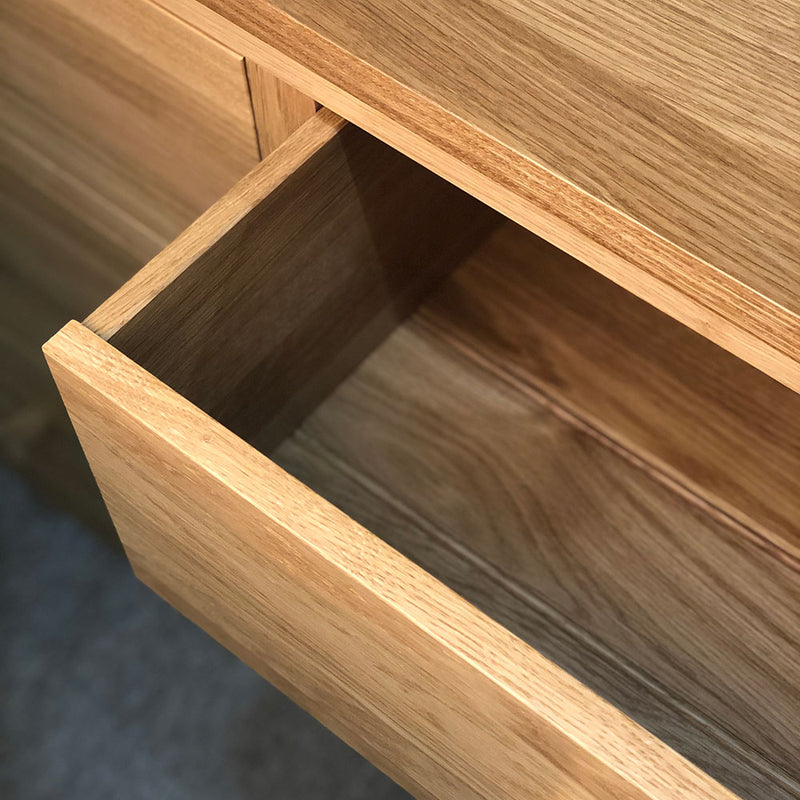close up drawer detail of solid oak chest of drawers
