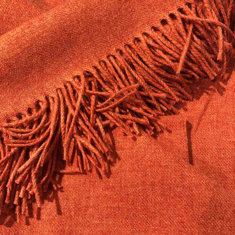 orange plain colour wool throw with fringe tassels 
