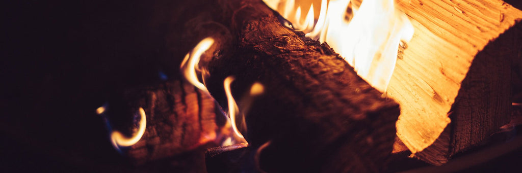 logs burning in a fireplace