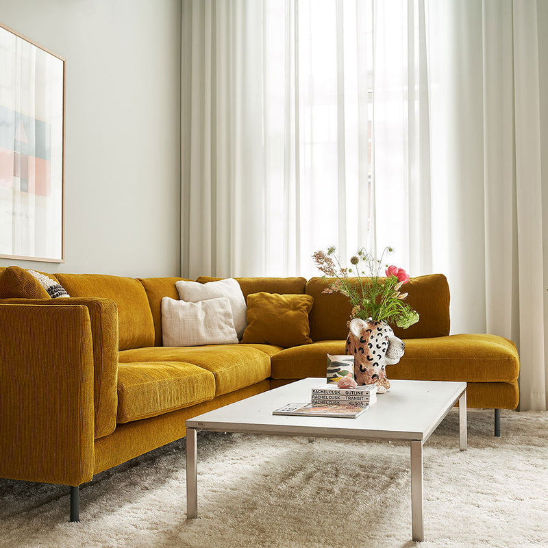 sigfrid sofa right corner moss fabric - mustard. lifestyle image with coffee table