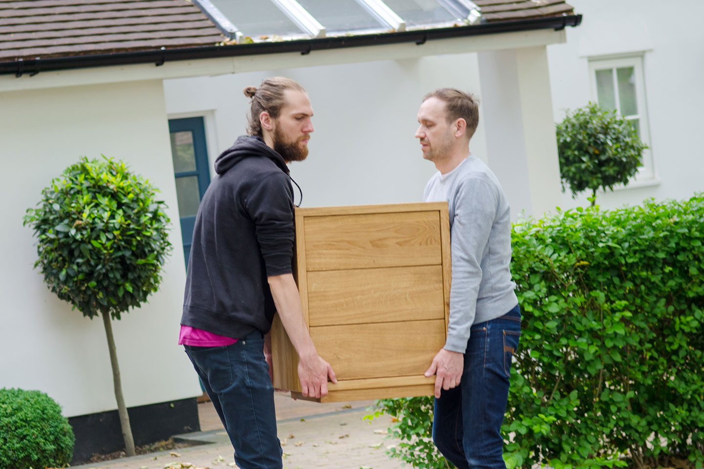 furniture being delivered to a home address by the blacks team.