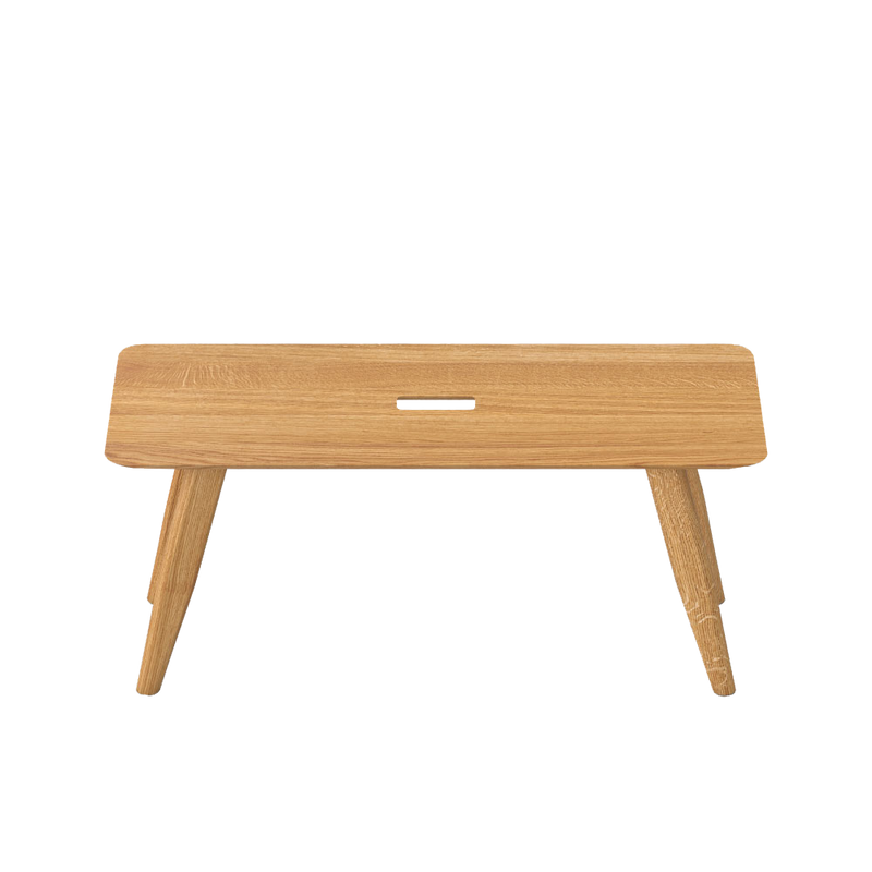 Oak atlas bench, angles legs with a hand hole in centre for moving around.