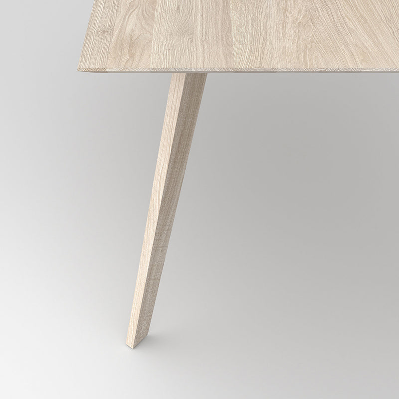 Detail shot of the leg profile on the citie table in white oil finish