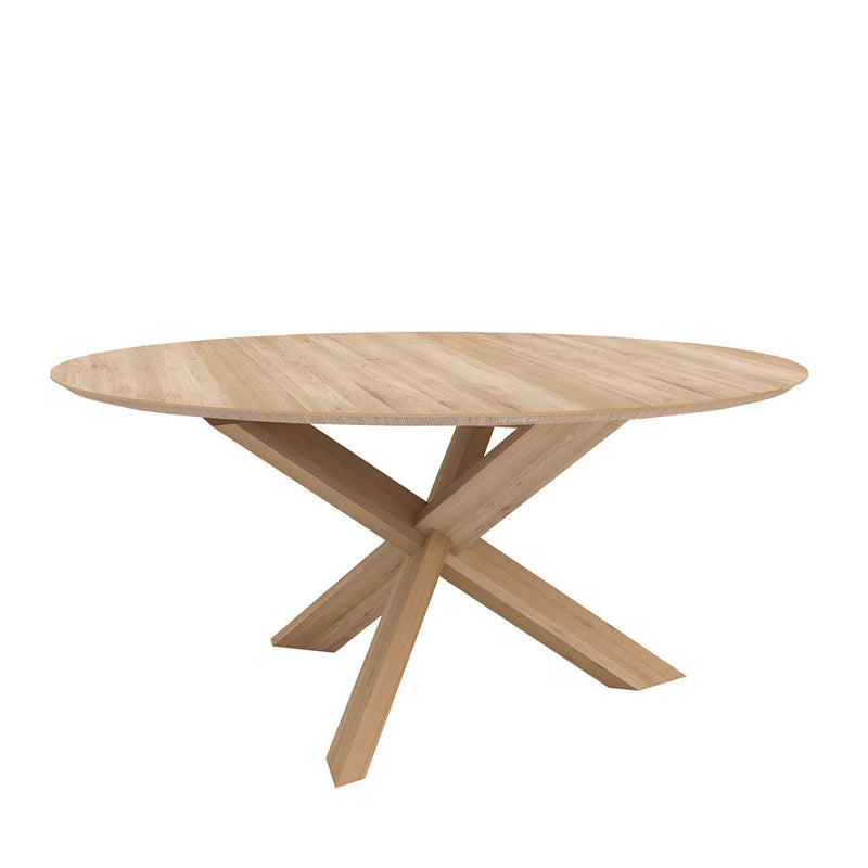 circle dining table, oak round top with a tapered edge. crossed leg pedestal