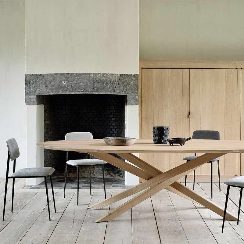 lifestyle shot of the table in use with dining chairs
