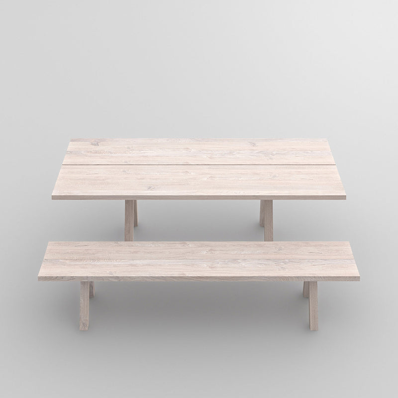 Facile oak table with trestle style legs finished in a white oil - shown with matching bench