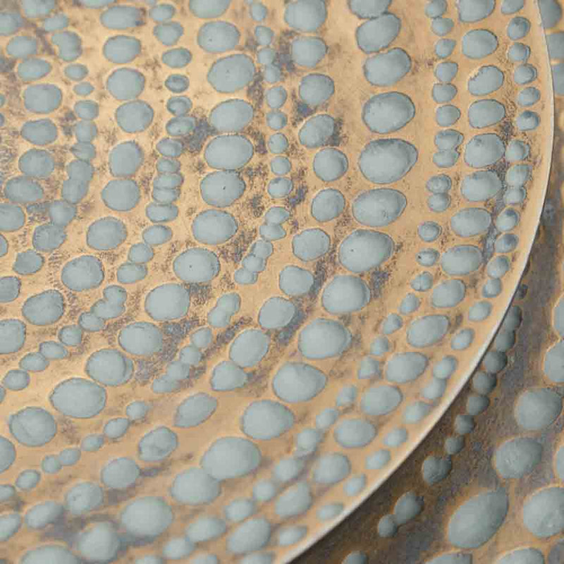 antique gold wall plate, detail of spotty pattern
