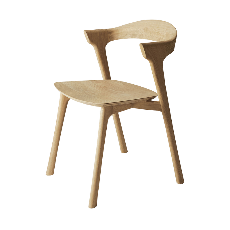 Luca solid oak chair with  rounded smooth back piece and curved seat.