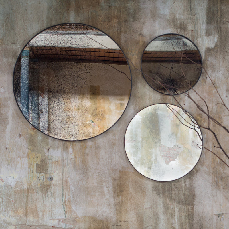 round aged mirrors shown in three sizes