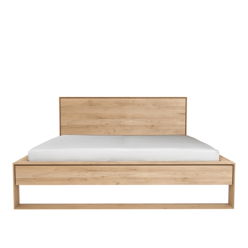 solid oak contemporary bed with panel headboard in a light oil finish
