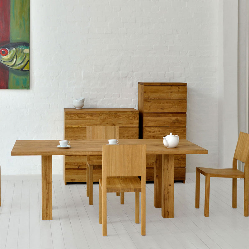 mallard  oak table shown with oak chairs in modern dining room.