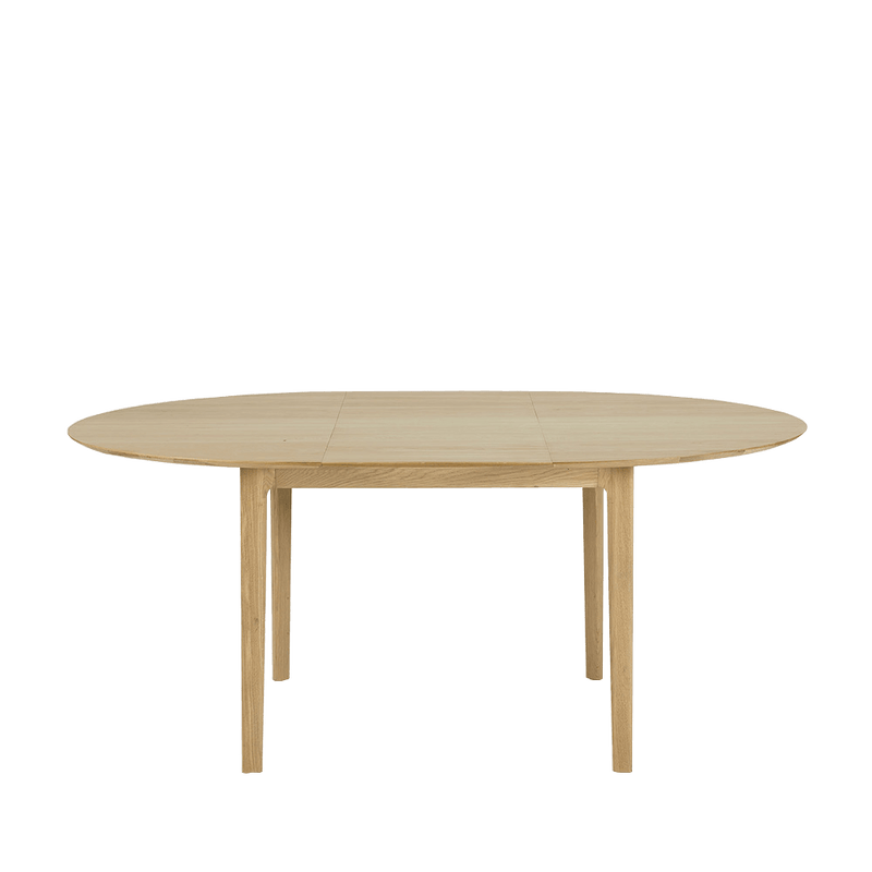 Oak extending round dining table in a light oil finish 