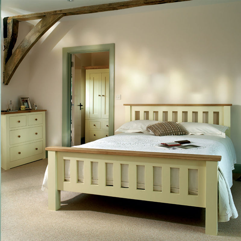 Provence made to order bedroom rangle showing 2 over 2 chest, slatted bed frame and wardrobe. all cream with oak tops.
