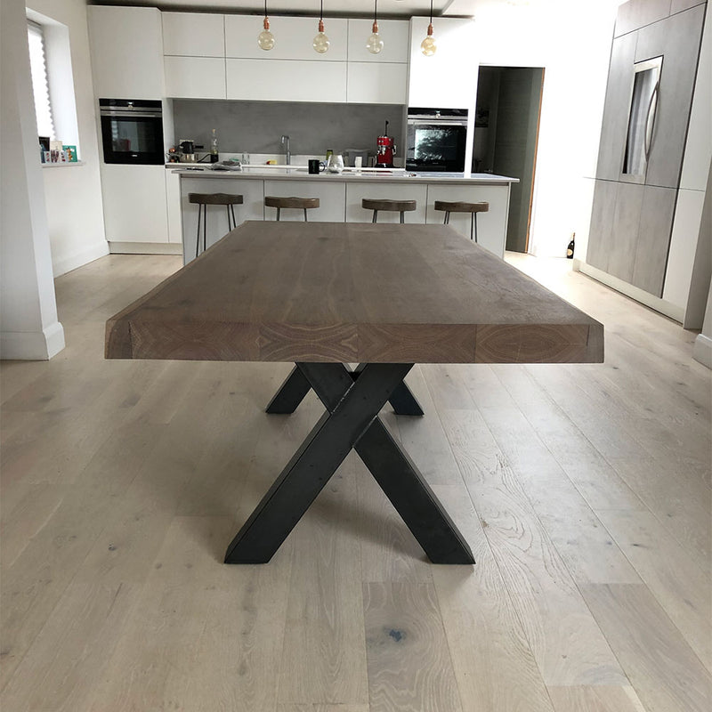 River dining table with industrial steel base in contemporary kitchen
