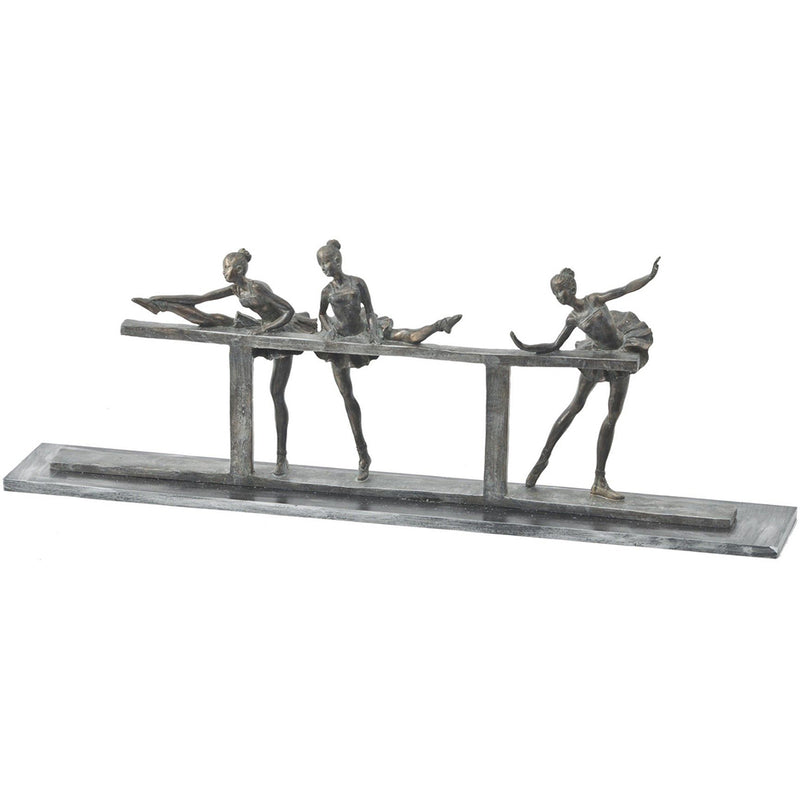 narrow sculpture with tree ballerinas practicing at the barre