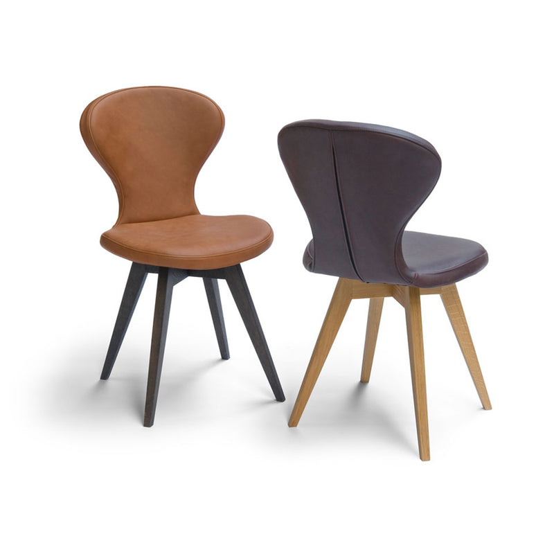 R1 dining chair bespoke options, shown in tan leather with black oak legs and black leather with natural oak legs