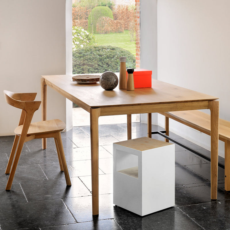 Oak B1 fixed dining table, shown in modern home with a mixture of chairs .