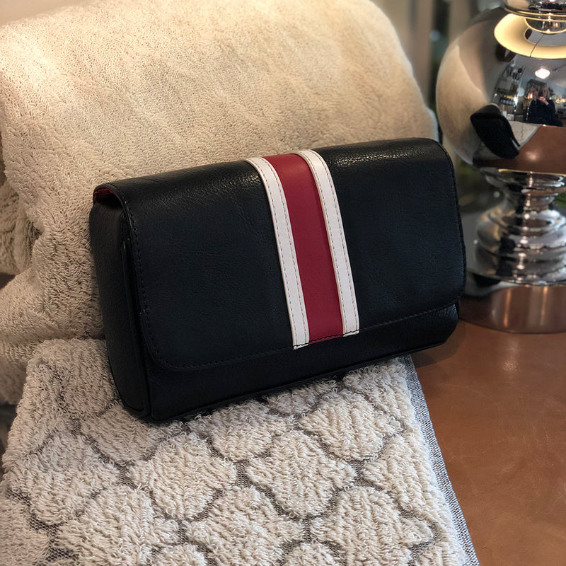 Dalton manbag black leather with a red over white stripe on the pouch flap.