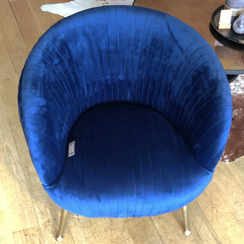 cobalt blue tub chair covered front and back with pleated velvet- front view of deep seat