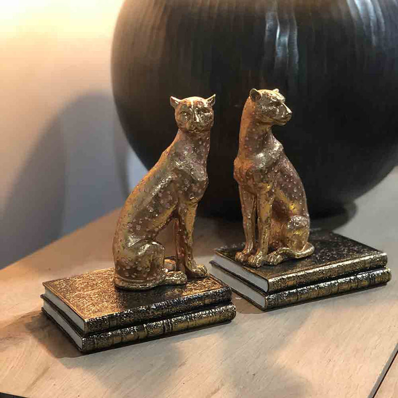 cheetah bookends pair. gold colour with pink spots 