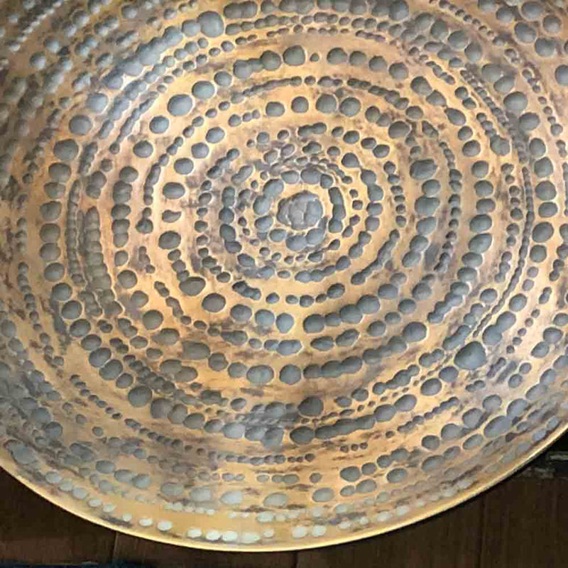 wall plate, dished golden plate, with textured dimpled patterning.