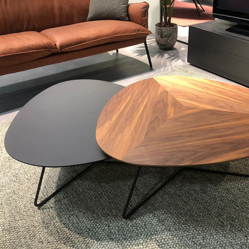 walnut and black fenix table in front of brown haarlem sofa