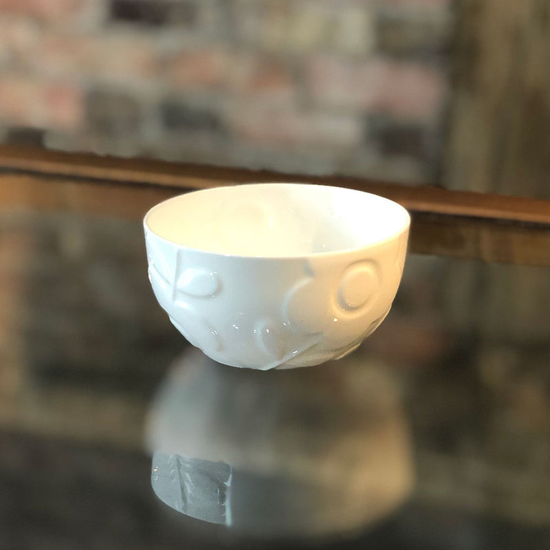 white bone china sugar bowl with flower raised pattern.
