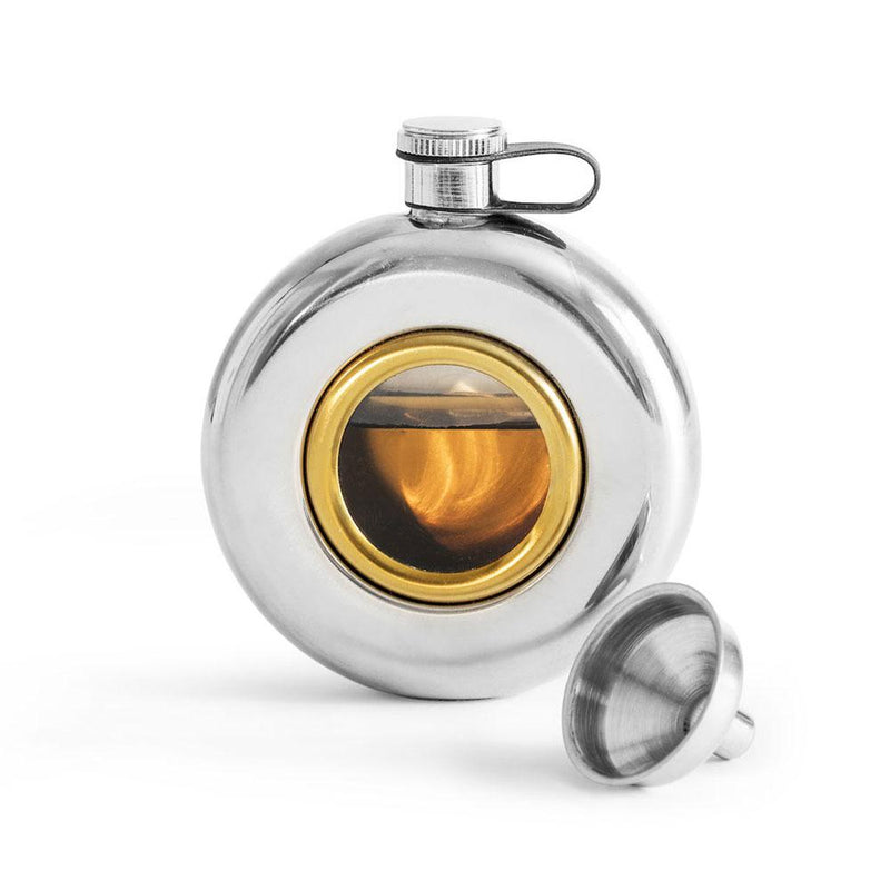 silver coloured metal round hip flask with glass window. screw cap lid. shown with funnel.