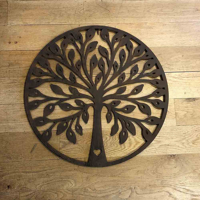 dark brown metal wall art, circle with tree of life design. 